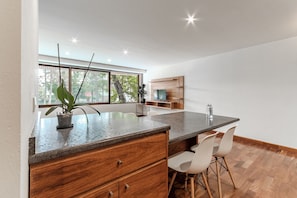 Business Apartment | Living area | 40-inch Smart TV with digital channels, Netflix, streaming services