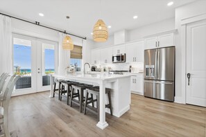 Townhome, Multiple Beds, Pool Access, Partial Ocean View (20722 First Ave - Grand Retreat I) | Private kitchen | Fridge, microwave, oven, stovetop - Grand Retreat I! 4BR 5BA Sleeps 15! Private Pool! Luxury and Comfort Await! (Panama City Beach)