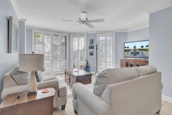 - Lounge in soft, coastal inspired seating while natural light pours through plantation shutters - Flat screen TV & ceiling fan make this space as functional as it is beautiful - Perfect blend of comfort & charm, ideal for movie nights or morning coffee