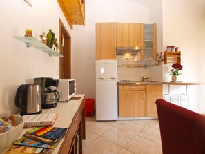 Fridge, microwave, stovetop, cookware/dishes/utensils