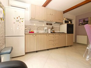 Fridge, stovetop, coffee/tea maker, cookware/dishes/utensils