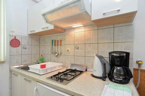 Fridge, stovetop, cookware/dishes/utensils