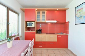 Fridge, microwave, stovetop, cookware/dishes/utensils