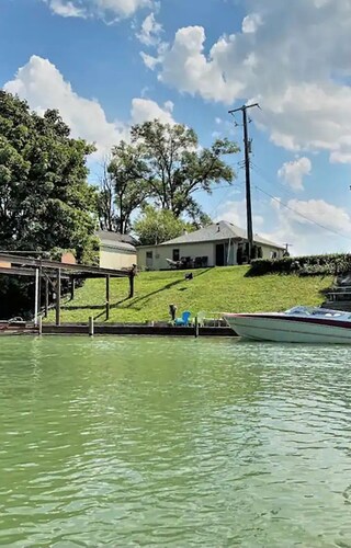 Cozy Black River Cottage with Private Dock and Boat Hoist-Sleeps 6