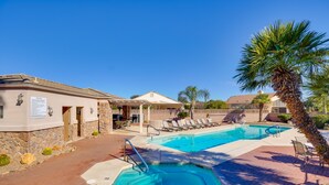 A pool area with lounge chairs and a palm tree. - Green Valley Getaway Near Golfing: Pool Access! (Green Valley)