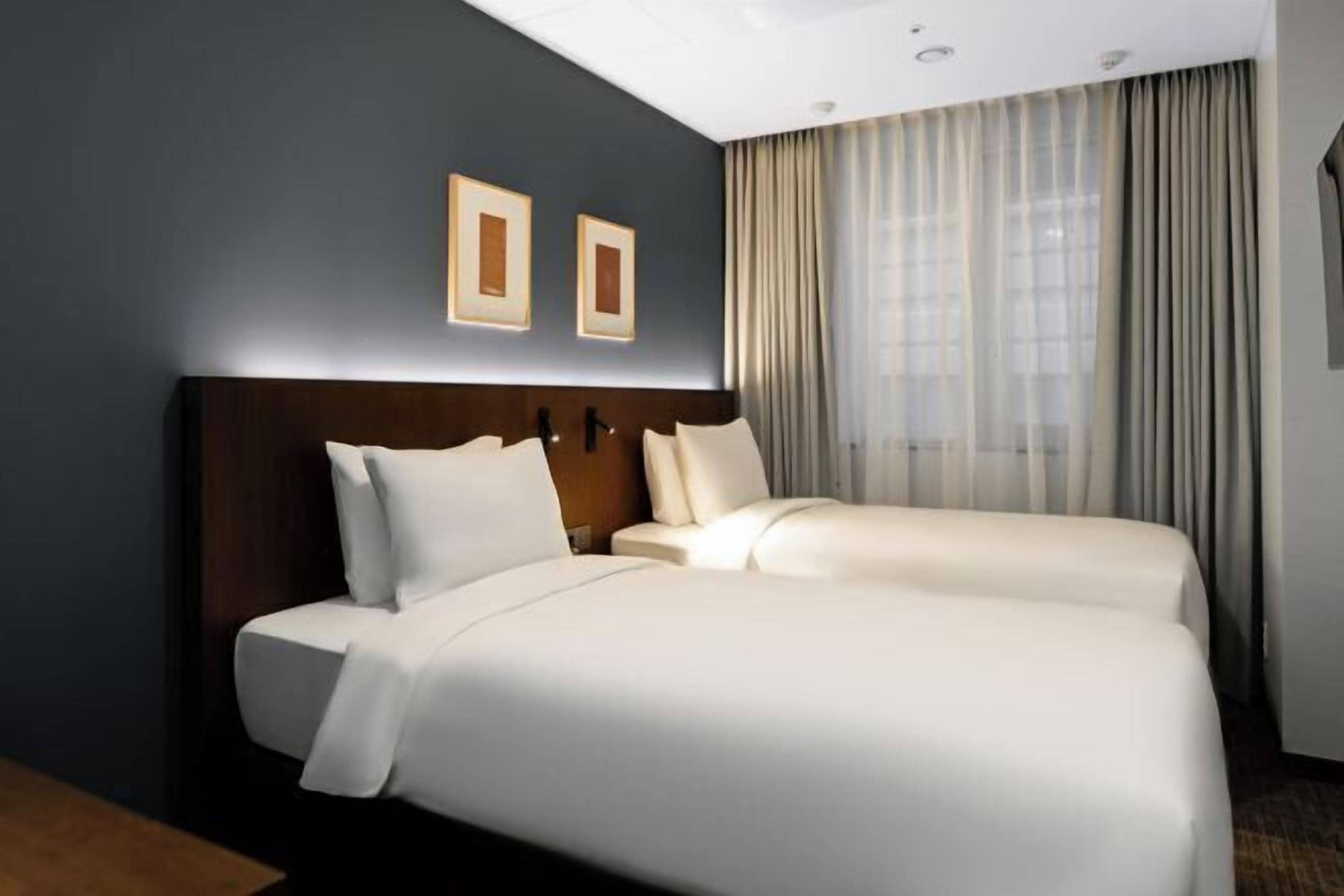 Premium bedding, down duvets, in-room safe, desk