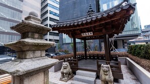 A traditional pavilion with a tiled roof, stone lion statues, and a stone pagoda. - The Prima Hotel Jongno Insadong (Seoul)
