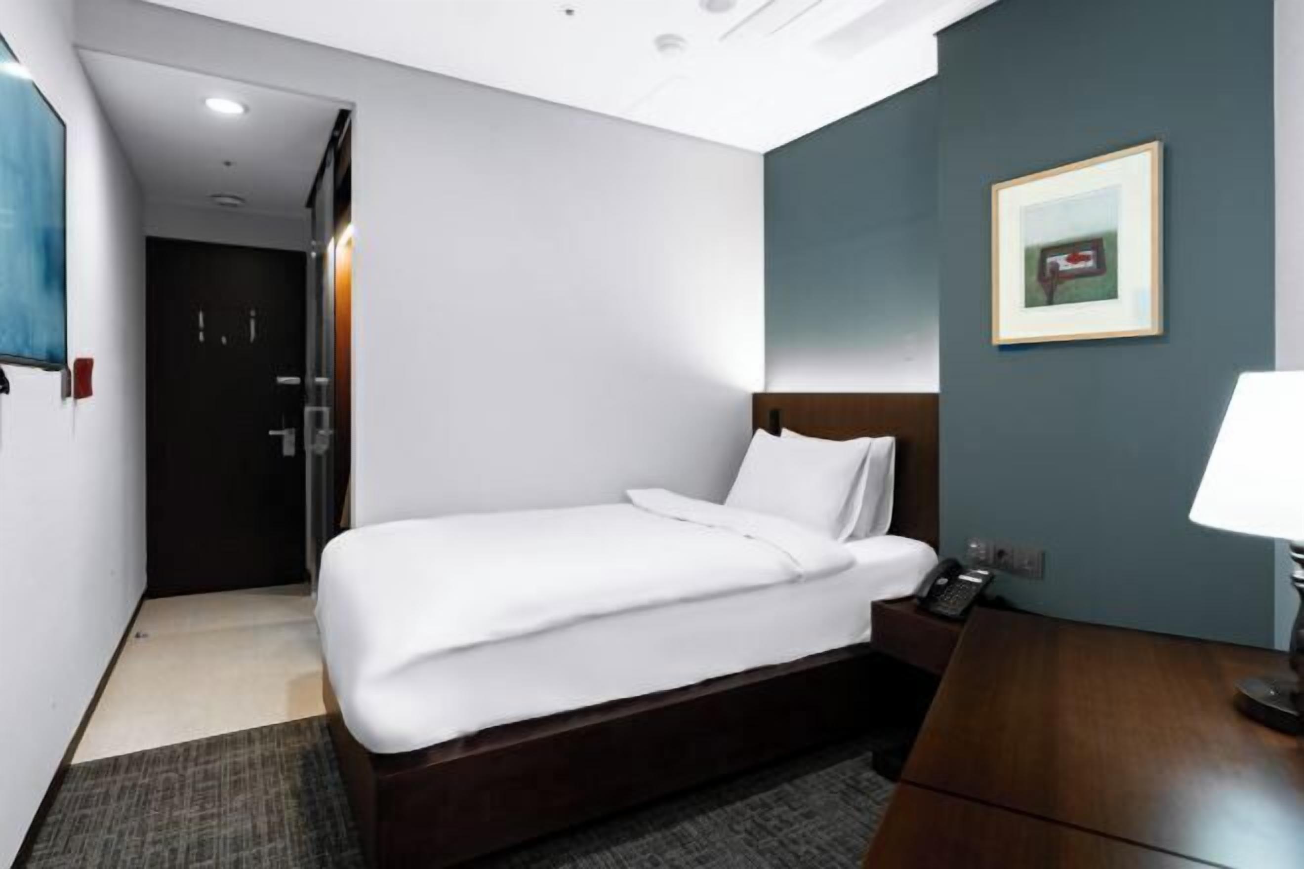 Premium bedding, down duvets, in-room safe, desk