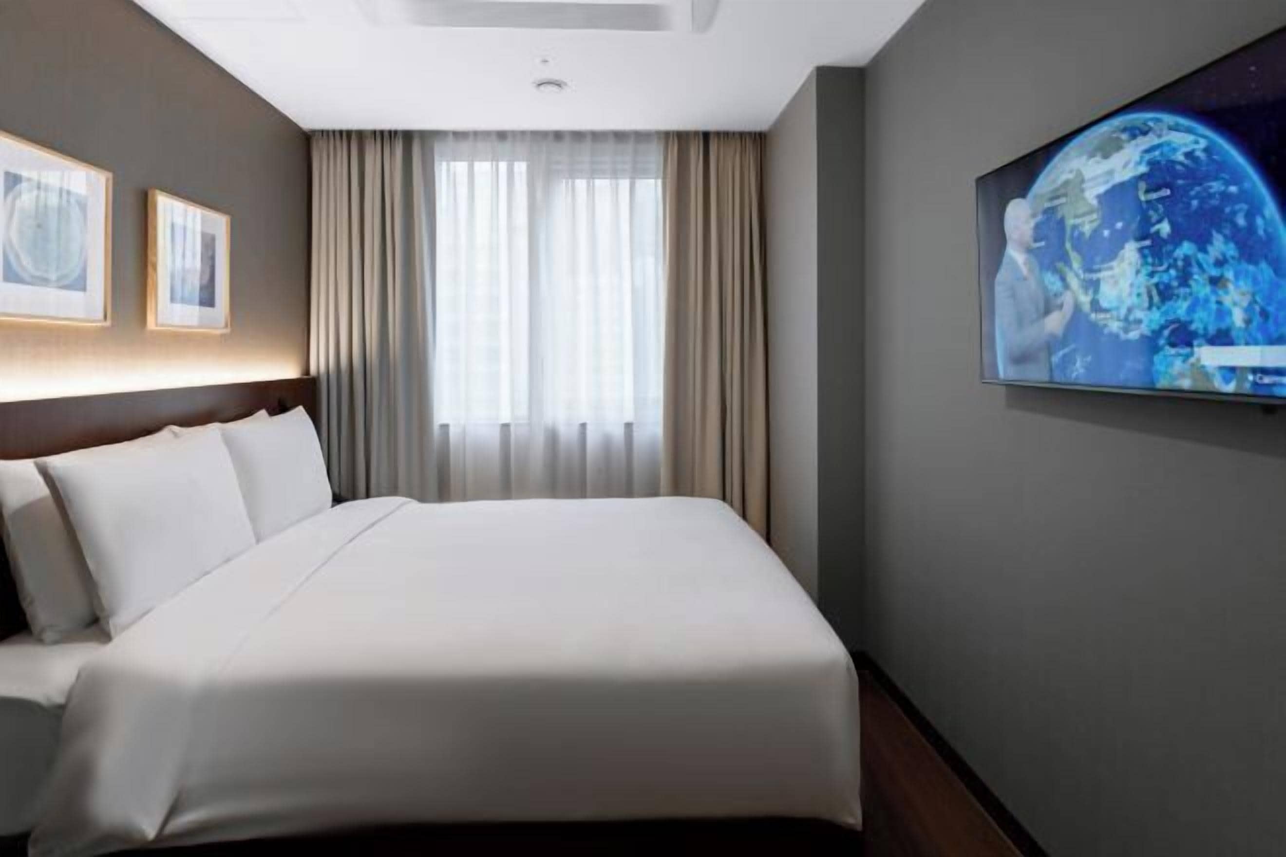 Premium bedding, down duvets, in-room safe, desk