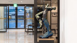 A sculpture in a lobby with glass doors and a visible exit sign. - The Prima Hotel Jongno Insadong (Seoul)