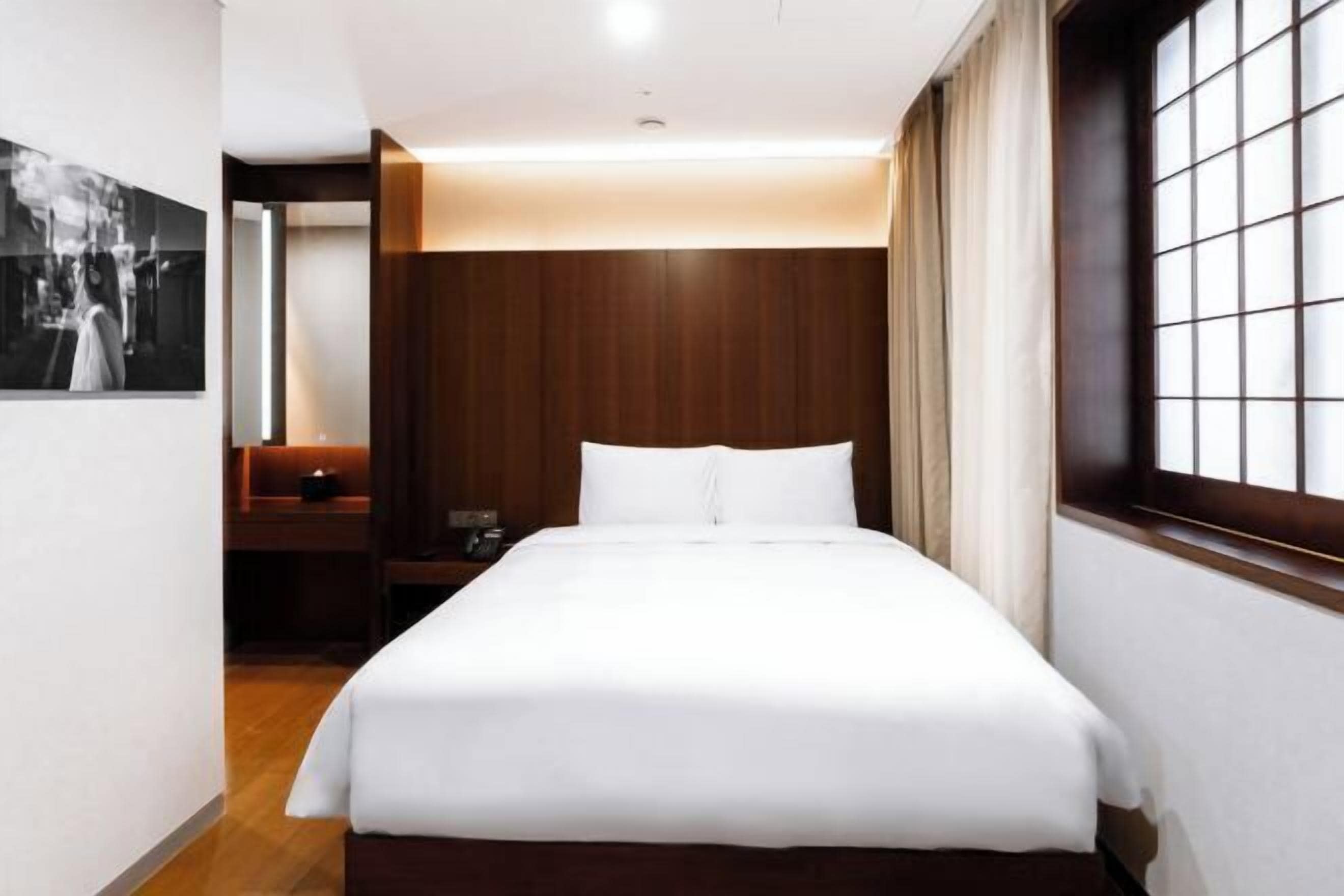 Premium bedding, down duvets, in-room safe, desk