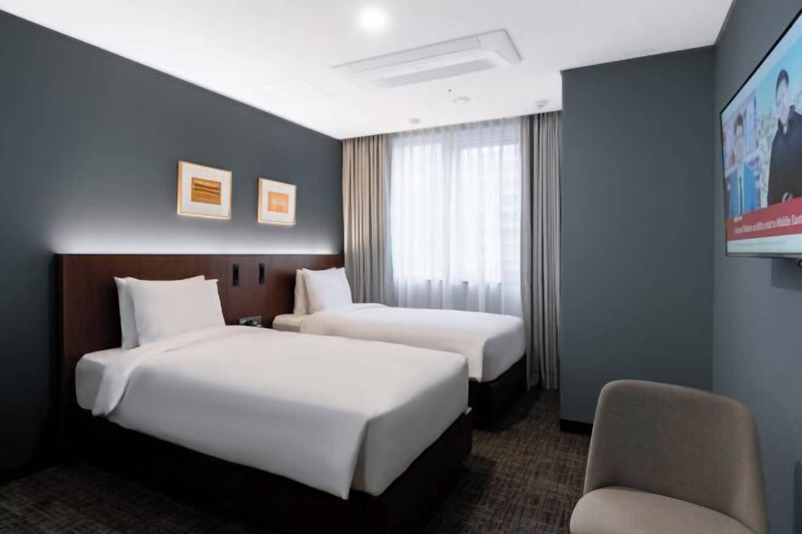 Premium bedding, down duvets, in-room safe, desk