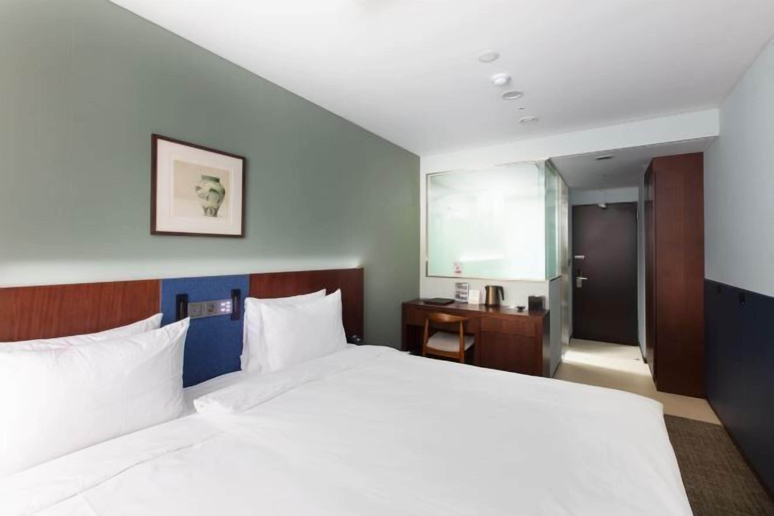 Premium bedding, down duvets, in-room safe, desk