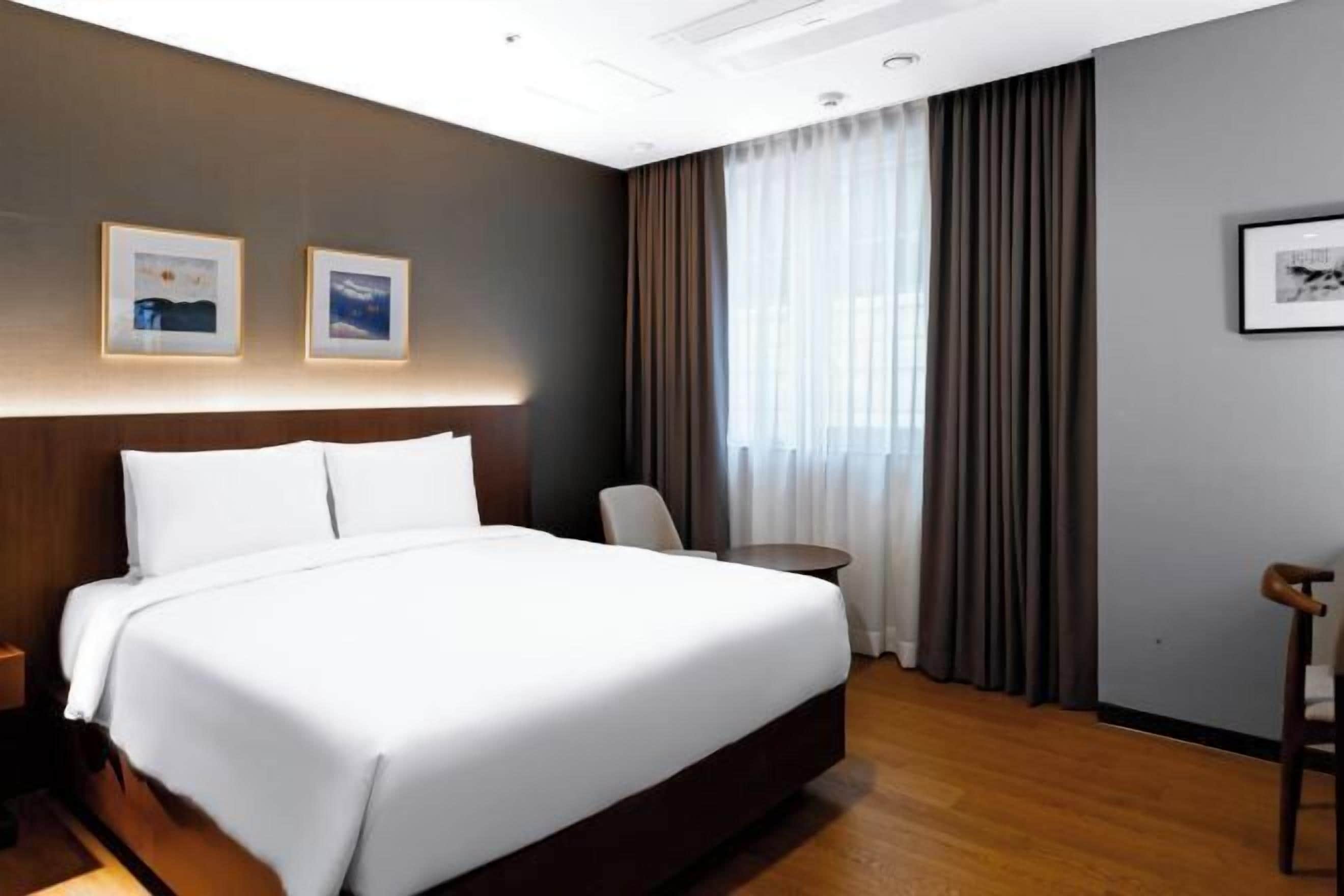 Premium bedding, down duvets, in-room safe, desk