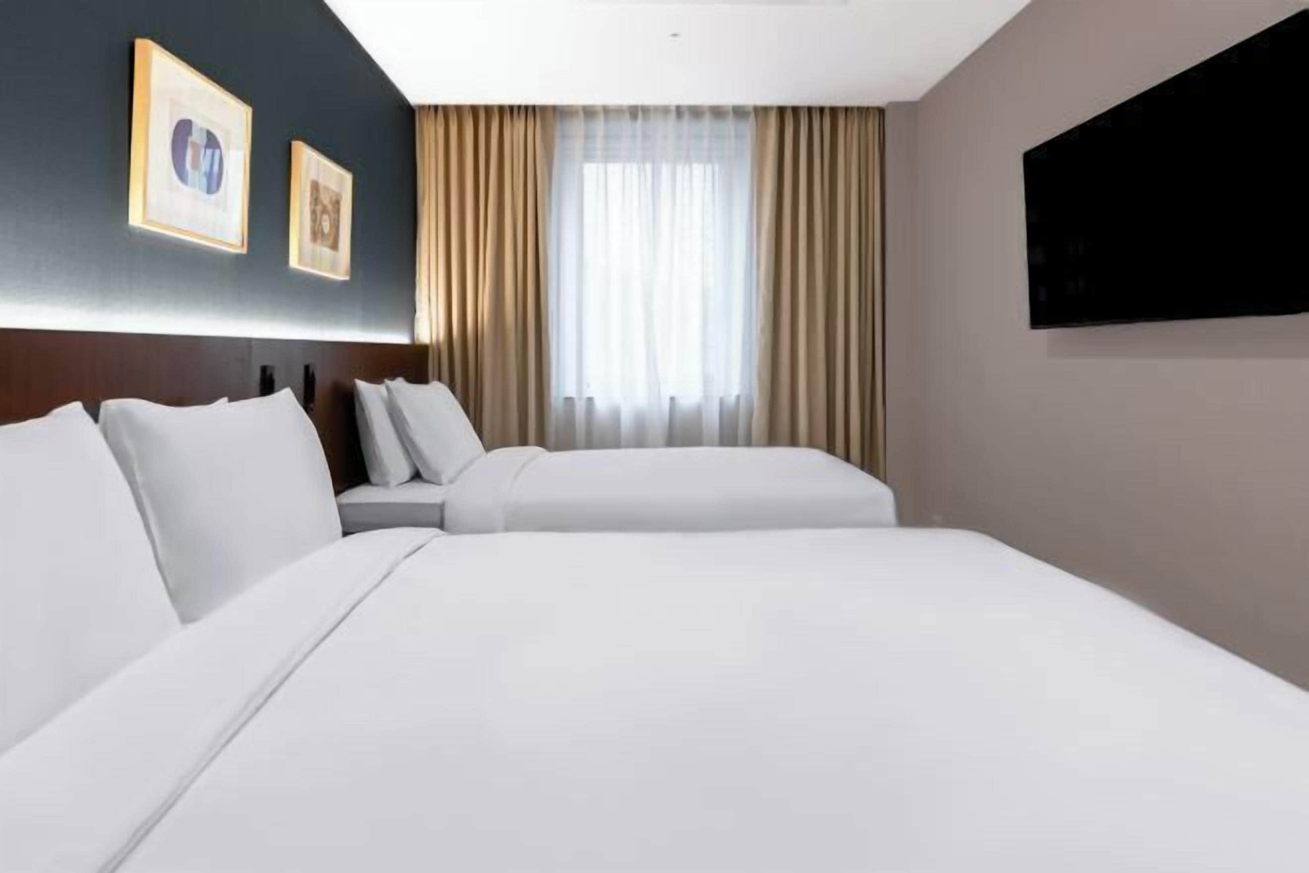 Premium bedding, down duvets, in-room safe, desk