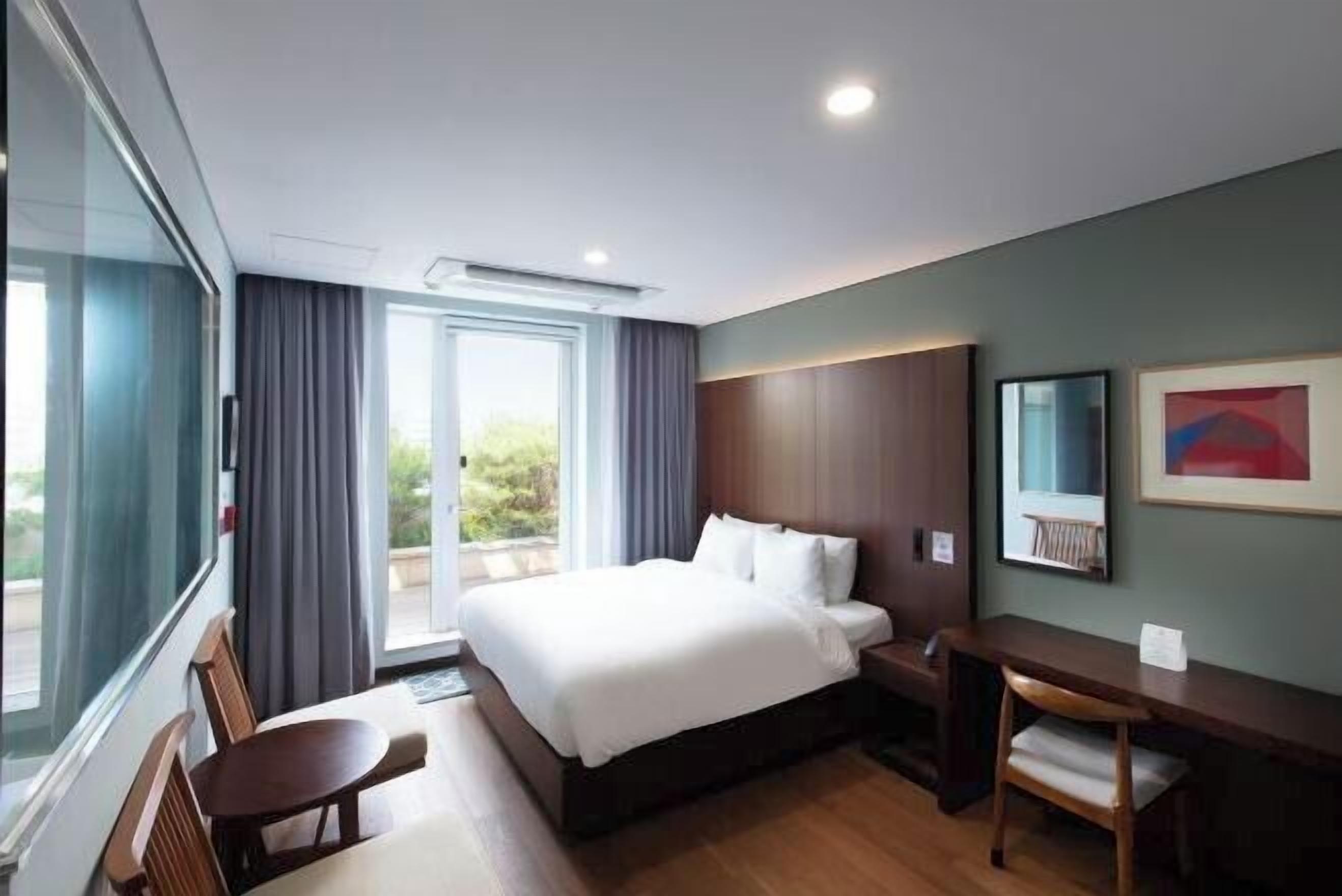 Premium bedding, down duvets, in-room safe, desk