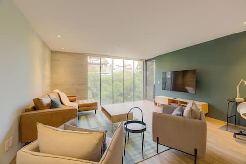Luxury Apartment, 3 Bedrooms, Balcony, City View | Living area | 45-inch flat-screen TV with cable channels