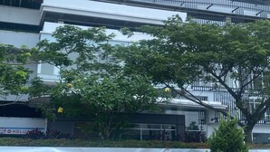 A modern building with multiple floors, balconies, and a covered area with plants. - Capital O 93529 September House (Tangerang)