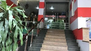 A hotel entrance with a staircase leading up to the reception area. - Thuy Ngu by Bay Luxury (Hanoi)