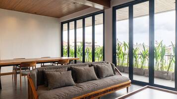 Penthouse, 3 Bedrooms | Living area | 32-inch LCD TV with cable channels