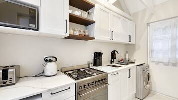 Fridge, coffee/tea maker, cookware/dishes/utensils, spices