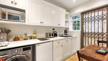 Fridge, microwave, stovetop, coffee/tea maker