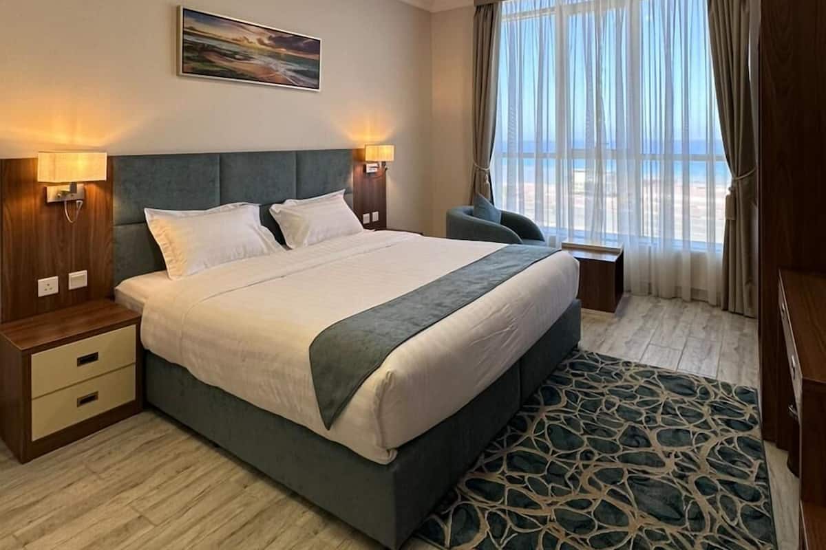 Deluxe Room, 1 King Bed, Smoking, Sea View | 1 bedroom, hypo-allergenic bedding, minibar, in-room safe