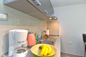 Fridge, stovetop, coffee/tea maker, cookware/dishes/utensils