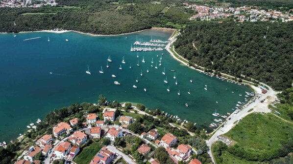 Stunning coastal town with a bustling marina and lush surroundings.