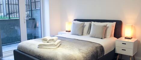 Apartment, 1 Bedroom | 1 bedroom, in-room safe, laptop workspace, iron/ironing board