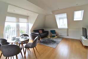 Apartment, 1 Bedroom | Living area | 42-inch Smart TV with cable channels, Netflix, streaming services