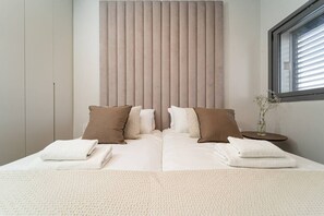 1 bedroom, desk, iron/ironing board, travel crib