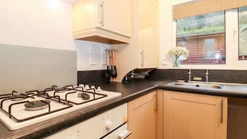 Fridge, electric kettle, toaster, cookware/dishes/utensils