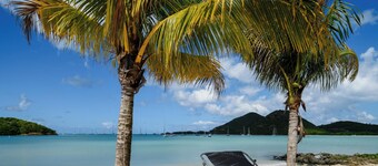 Tranquil Waterfront Villa ~ steps from the  Beach, with bikes and terrace views