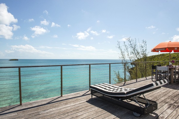 Welcome to Touch of Class Estate. Our decks have the best ocean views on the island! Steps lead right down into the water with a perfect sandy bottom.
