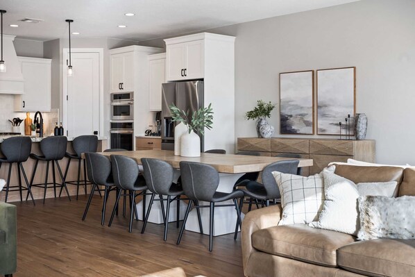 Enjoy cooking in this well-equipped kitchen with a central island and stainless steel appliances.