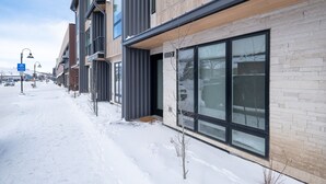 A modern building with large windows and a brick facade. - Townhome in the heart of Silverthorne! Walk to everything! (Silverthorne)
