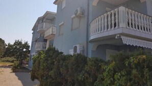 A multi-story building with balconies and air conditioning units. - BlueSun
Two Bedroom Apartment with terrace  (Zaton)