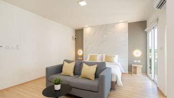 Suite, 1 Bedroom with balcony | Living area | 40-inch Smart TV with digital channels