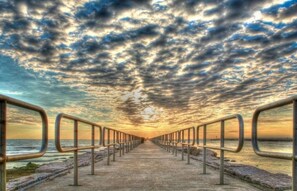 Stroll along the scenic coastal promenade with breathtaking views of the ocean.