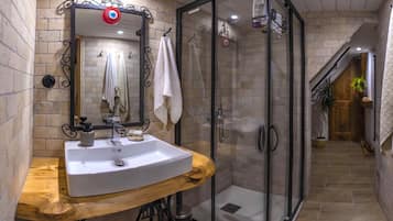 Shower, hair dryer, towels, toilet paper
