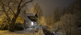 Stone house overlooking mountain river