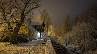 Stone house overlooking mountain river