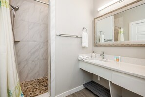 Shower, hair dryer, towels, shampoo