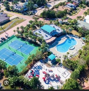 Relax by the resort's large pool surrounded by palm trees and lounge chairs, or enjoy a game of tennis on one of the two courts.