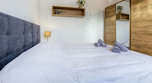 1 bedroom, desk, iron/ironing board, travel crib