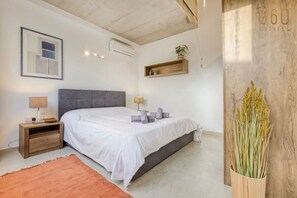 1 bedroom, desk, iron/ironing board, travel crib