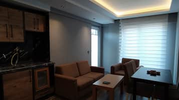 Standard Apartment | Living area | 66-cm TV with satellite channels, heated floors