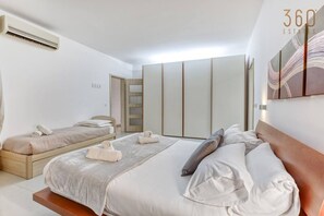 2 bedrooms, desk, iron/ironing board, travel crib