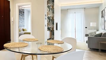 Premium Apartment, 1 Bedroom, Kitchen | Living area | 50-inch flat-screen TV with digital channels, Netflix, smart speakers